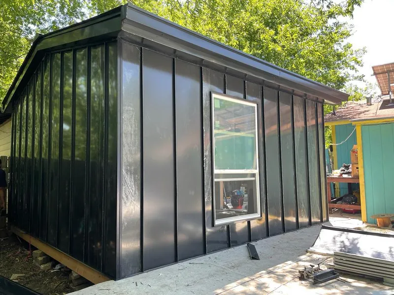 Black standing seam metal wall panels for Roof Inspection in Arkansas City